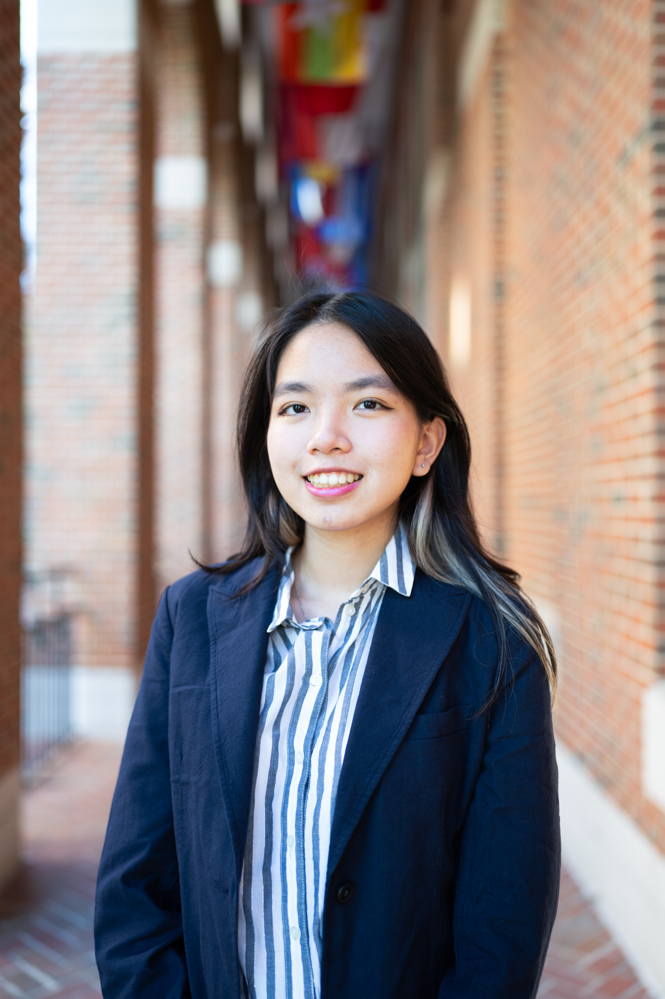 A professional headshot of Khue