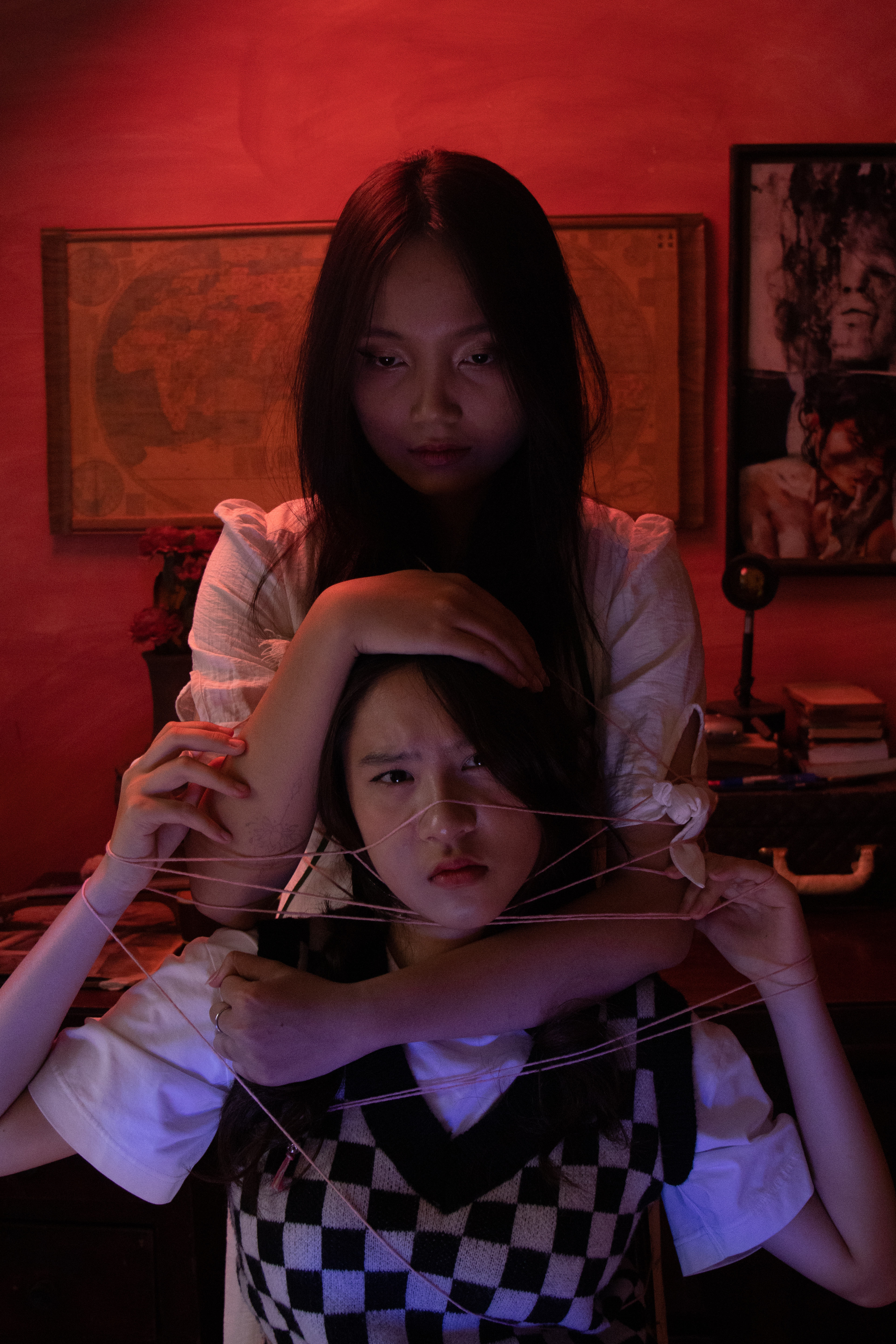 A portrait of two girls that play as mother and daughter